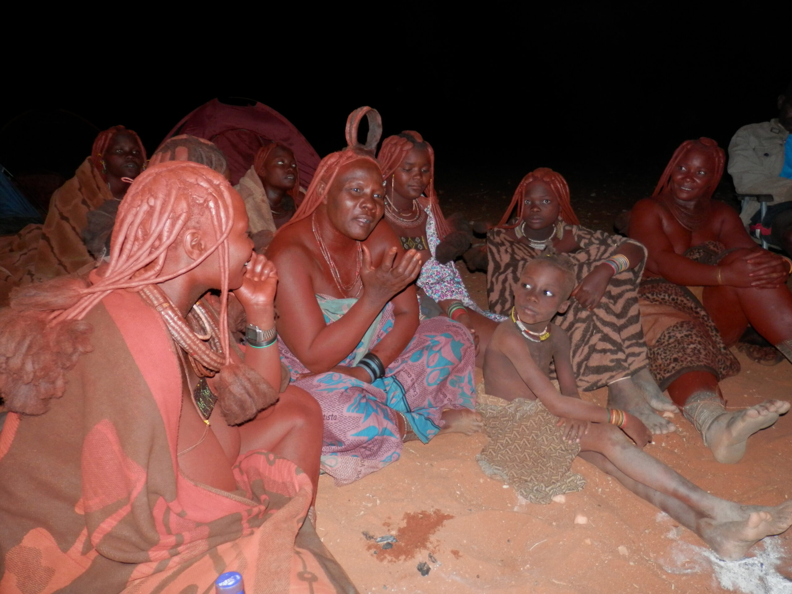 A Himba woman enthusiastically practicing re-telling a story of the Bible in her own language