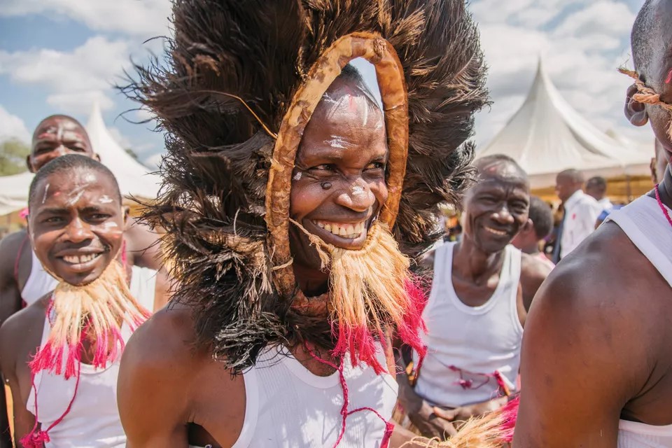 Tharaka people smiling and celebrating in traditional dress