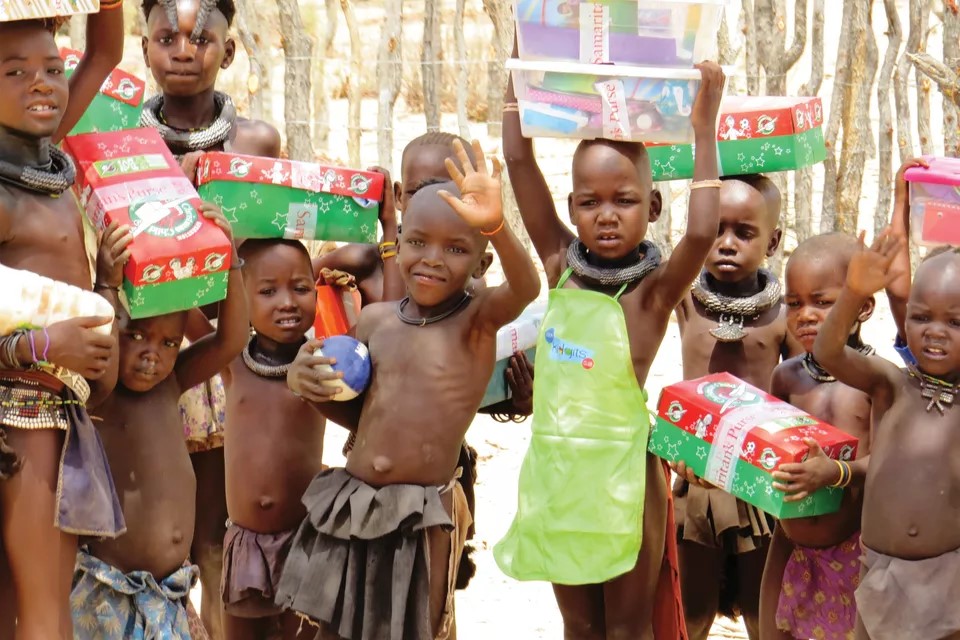 Himba children with Operation Christmas Child shoeboxes