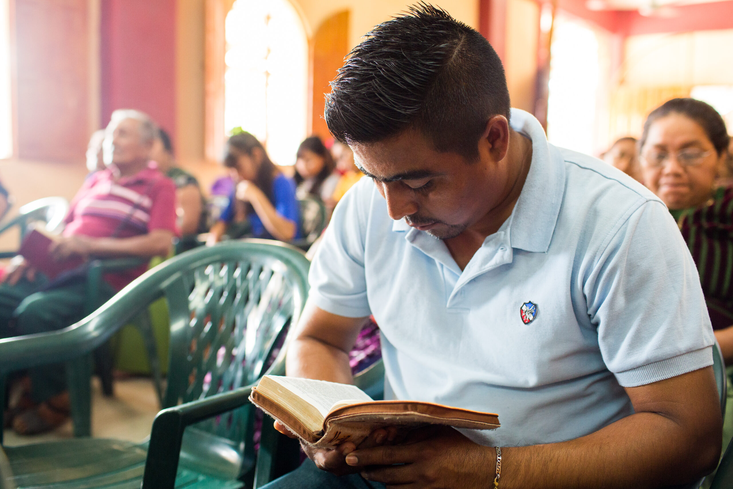 A man in the Zapateco del Istmo Cluster in Mexico reads the Bible in church