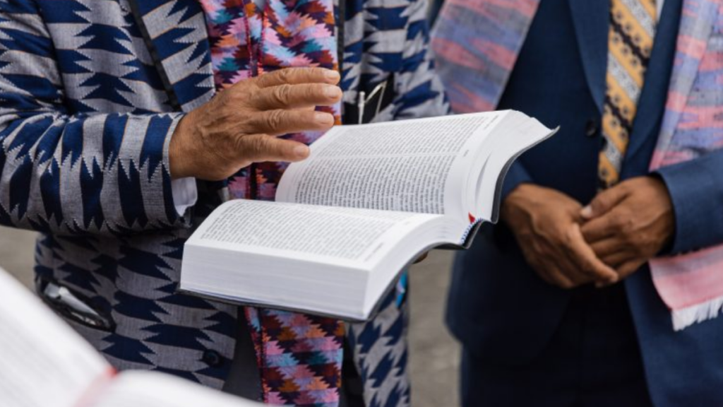 Hands holding a Bible