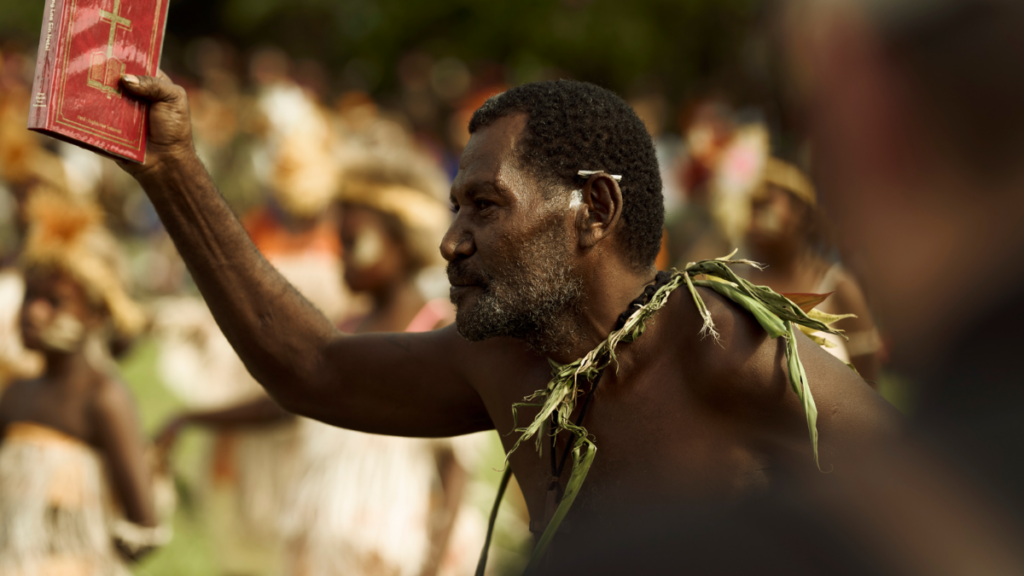Man holding up Bible