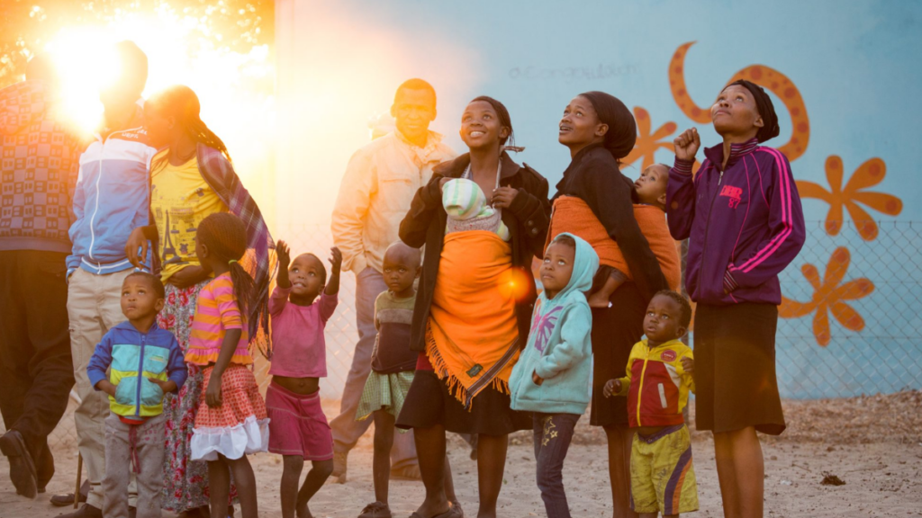 Group of people in colorful clothing celebrating